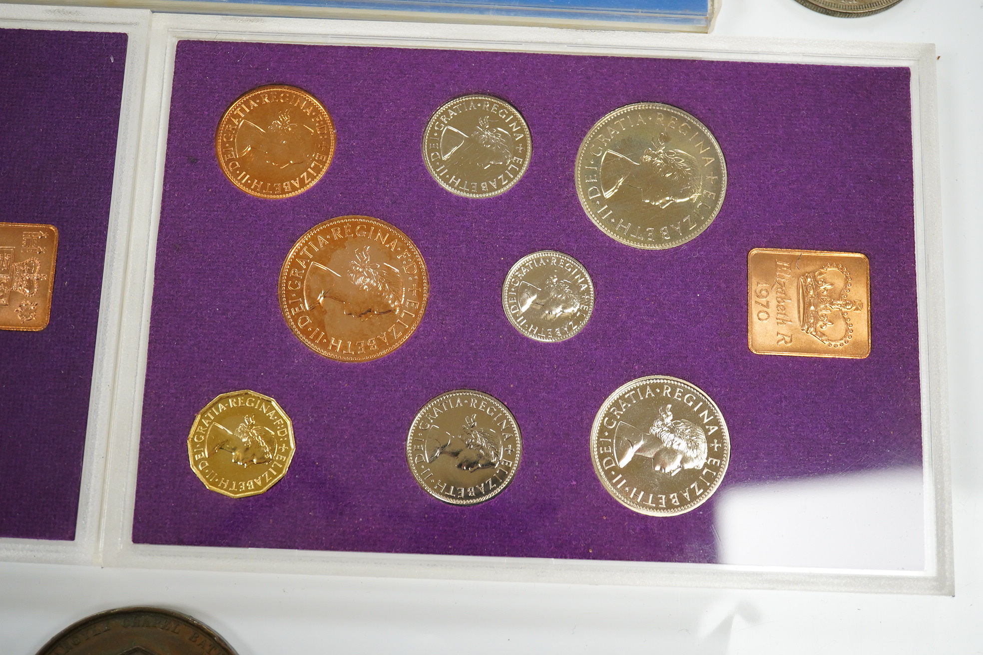 A small collection of coins including two 1970 proof sets, a 1953 set, a George III crown, a 1933 George V crown and a medallion for the Argyle Chapel, Bath. Condition - fair